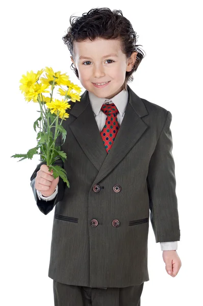 Menino adorável com flores — Fotografia de Stock