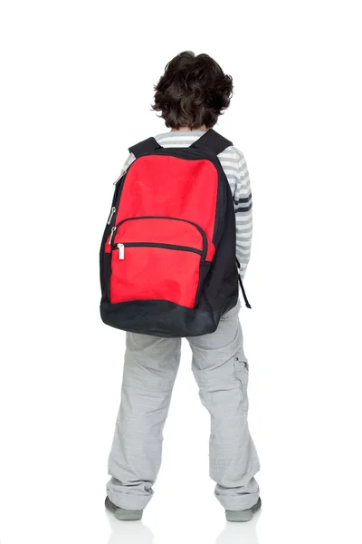 Criança anônima de volta com um pacote pesado — Fotografia de Stock