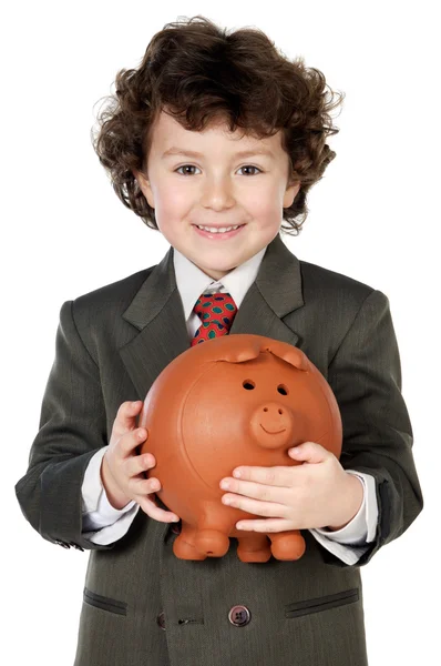 Adorable enfant avec ses économies dans sa boîte à monnaie de cochon — Photo