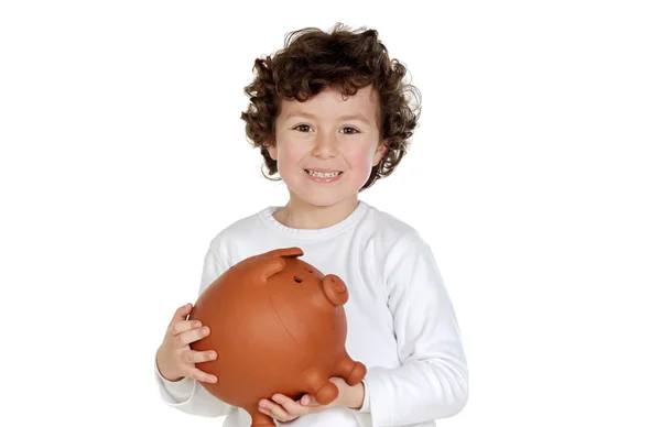 Adorable child with its savings in its money box of piggy — Stock Photo, Image