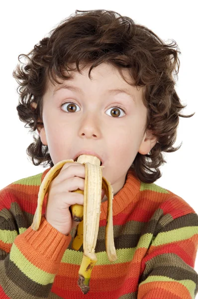 Kind isst eine Banane — Stockfoto
