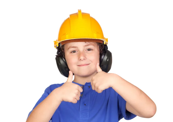 Criança bonita com capacete amarelo dizendo OK — Fotografia de Stock