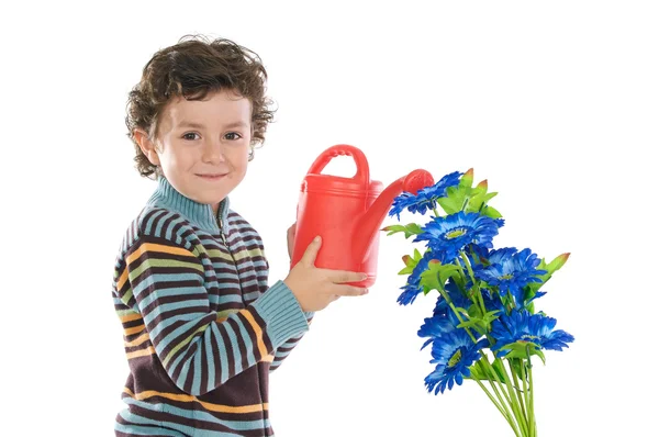 Bambino che innaffia fiori — Foto Stock