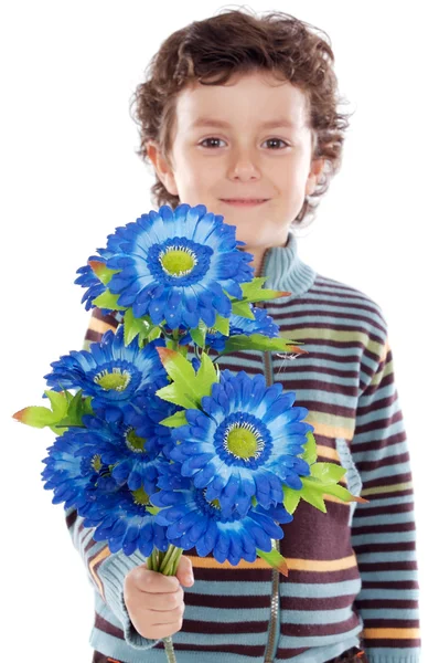 Schattige jongen met bloemen — Stockfoto
