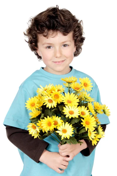 Bedårande pojke med blommor — Stockfoto