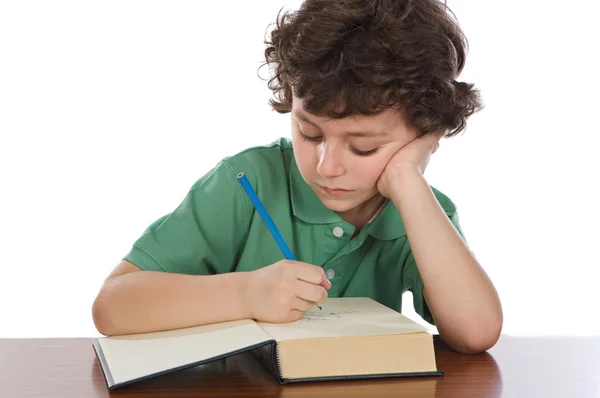 Criança adorável escrever em livro — Fotografia de Stock