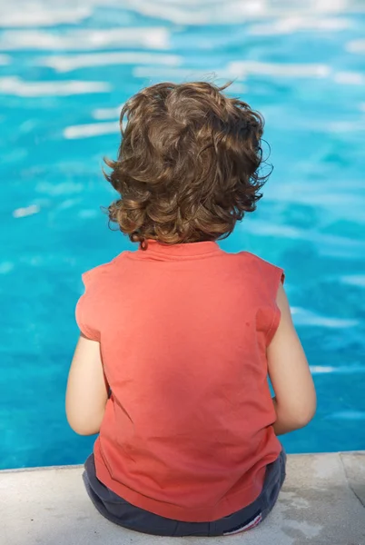 Adorable boy watching water — Stock Photo, Image