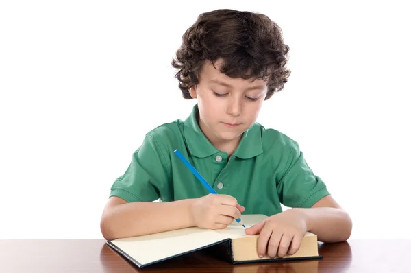 Schattig kind schrijven in boek — Stockfoto