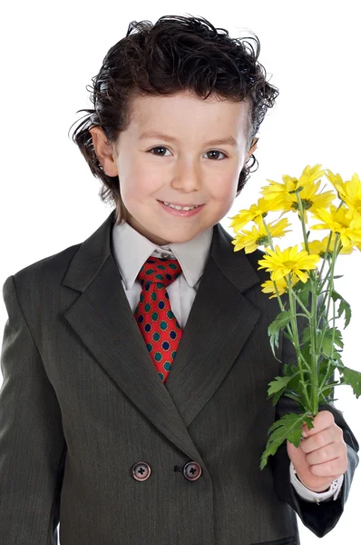 Adorable boy with flowers — Stock Photo, Image