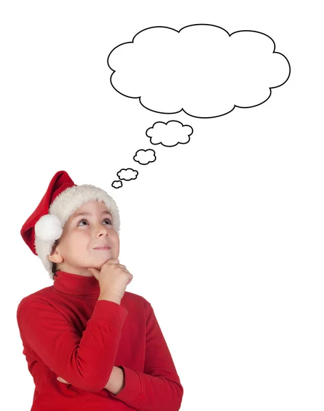 Adorable boy with santa hat thinking — Stock Photo, Image