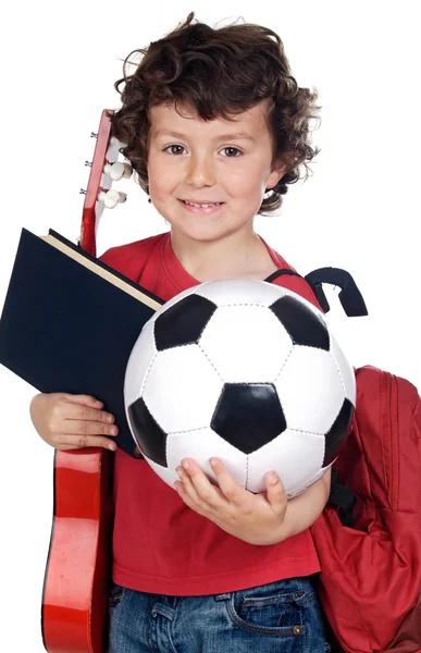 Kind met bal, boek en gitaar — Stockfoto