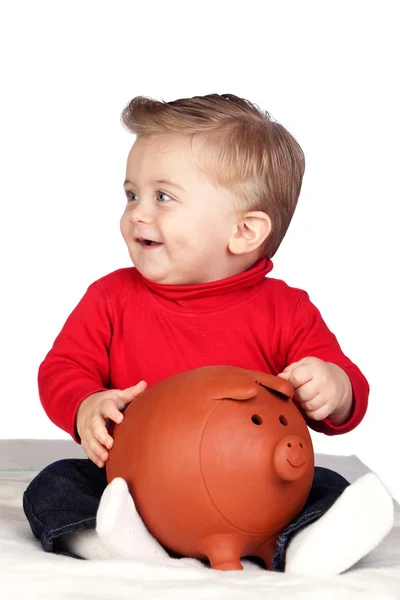 Hermoso bebé rubio con una alcancía — Foto de Stock