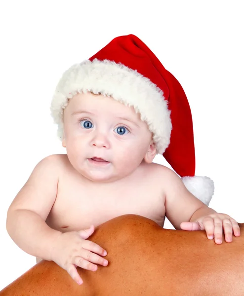 Schöne Babe mit blauen Augen und Weihnachtsmütze — Stockfoto