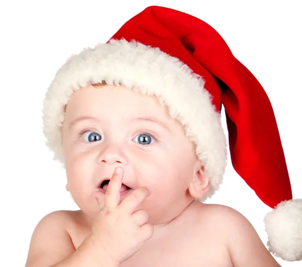 Schöne Babe mit blauen Augen und Weihnachtsmütze — Stockfoto