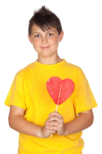 Funny child with yellow t-shirt with a big lollipop — Stock Photo, Image