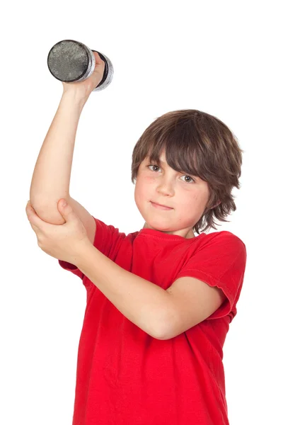 Смешной ребенок играет в спорт с гирями — стоковое фото