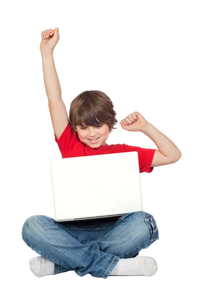 Winner little boy sitting with laptop — Stock Photo, Image