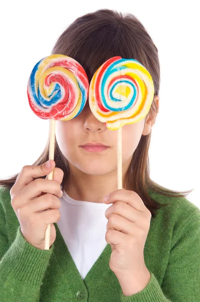 Dívku jíst dva lízátka — Stock fotografie
