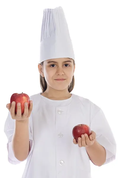 Μάγειρας αξιολάτρευτο κορίτσι με μήλα — Φωτογραφία Αρχείου