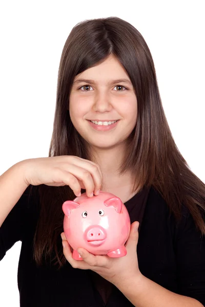 Adorável menina pré-adolescente com um porquinho-banco — Fotografia de Stock