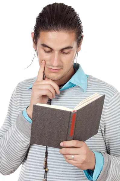 Rapaz atraente lendo um livro — Fotografia de Stock