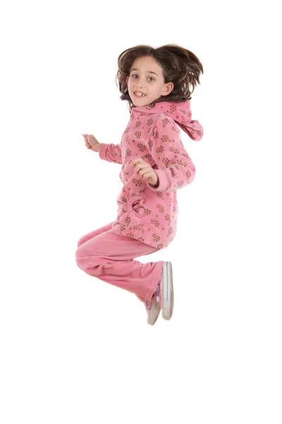Niña alegre saltando — Stockfoto