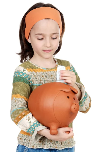 Girl putting its savings — Stock Photo, Image