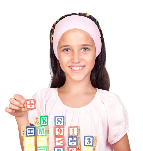 Little girl with with wooden blocks stacked — Stock Photo, Image