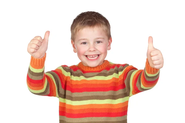 Очаровательный ребенок с большими пальцами вверх — стоковое фото
