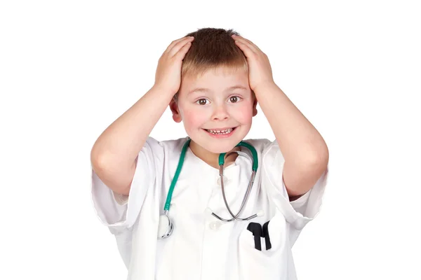 Förvånad barn med läkare uniform — Stockfoto