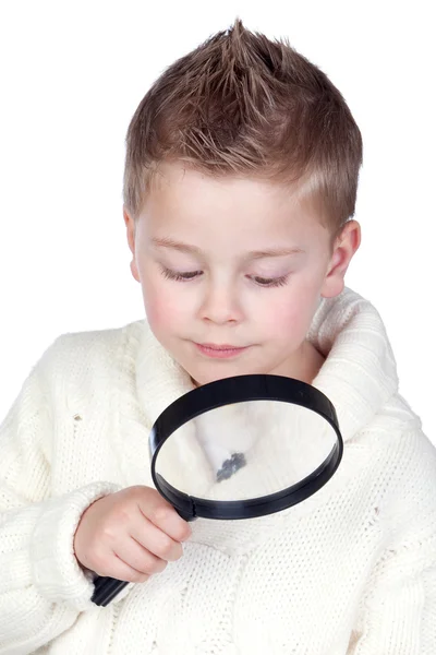 Schattig kind met een vergrootglas — Stockfoto