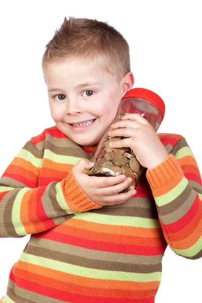 Criança adorável com um frasco de vidro com muitas moedas — Fotografia de Stock