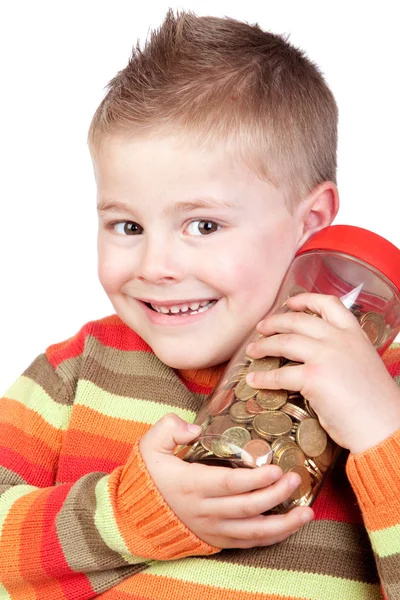 Bambino adorabile con un barattolo di vetro con molte monete — Foto Stock