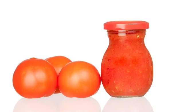 Three fresh tomatoes with tomato sauce boat — Stock Photo, Image