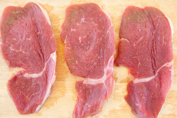 stock image Three steaks raw salted pork