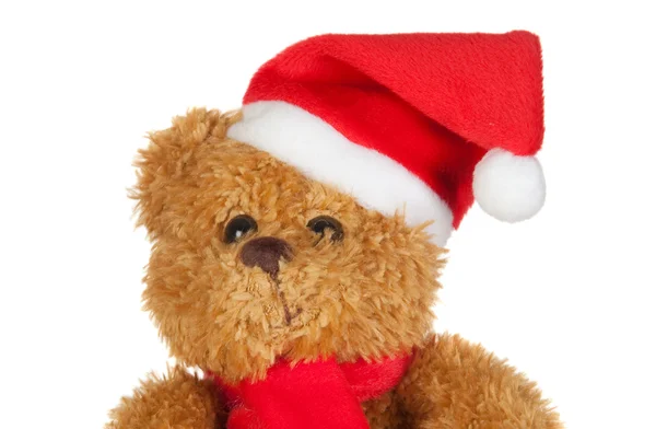Eşarp ve Noel şapka ile güzel bir oyuncak ayı — Stok fotoğraf