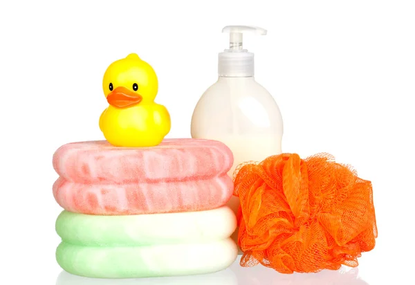 Yellow plastic duck over sponges and boat bath dispenser isolate — Stock Photo, Image