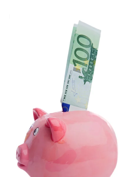 Saving a note of one hundred euros in a piggy-bank — Stock Photo, Image