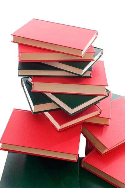 Many books stacked on a white background — Stock Photo, Image