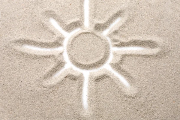 Photo of the sun painted on the sandy The sun painted on the sa — Stock Photo, Image