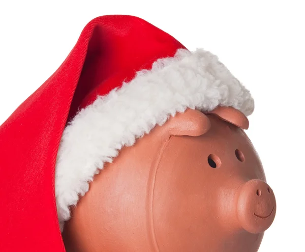 산타 클로스 모자와 함께 돼지 저금통 — 스톡 사진