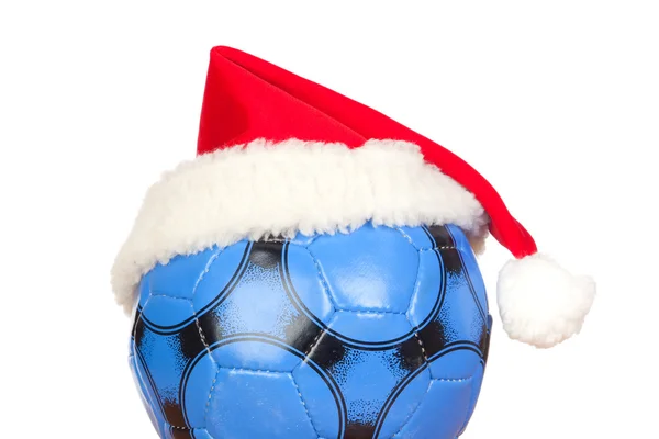 Bola de futebol azul com chapéu de Natal — Fotografia de Stock