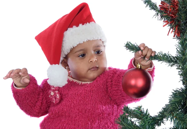Baby flicka som leker med julgran Royaltyfria Stockfoton