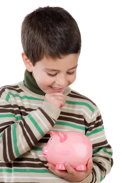 Adorable child thinking what to buy with their savings Royalty Free Stock Photos