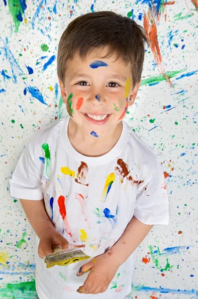 Boy playing with painting Stock Image