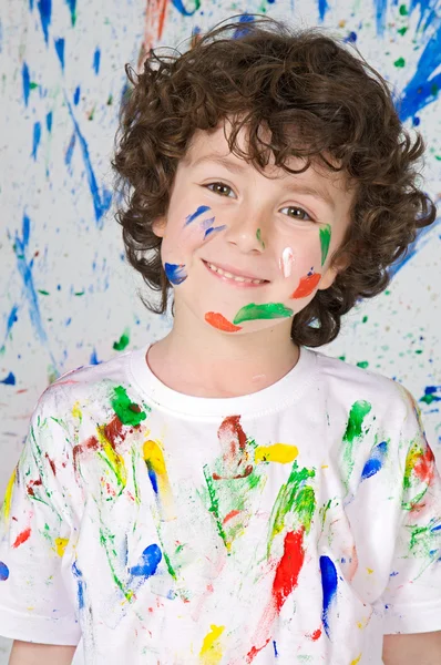 Boy playing with painting Royalty Free Stock Photos