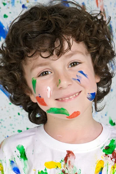 Boy playing with painting Stock Image