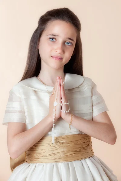 Pretty girl on the day of their communion Stock Photo