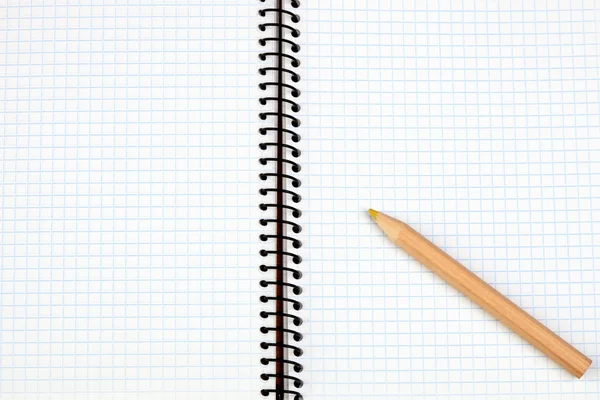 Sharp pencil on a spiral notebook Royalty Free Stock Photos