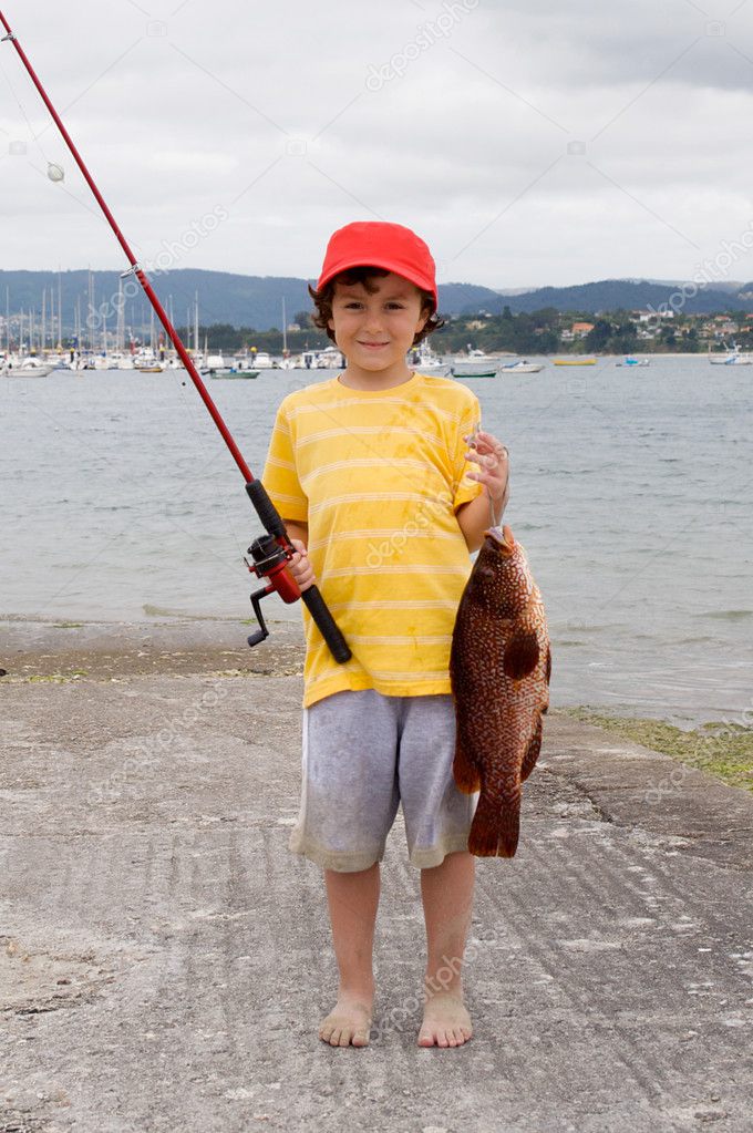 Child fisherman with red hat